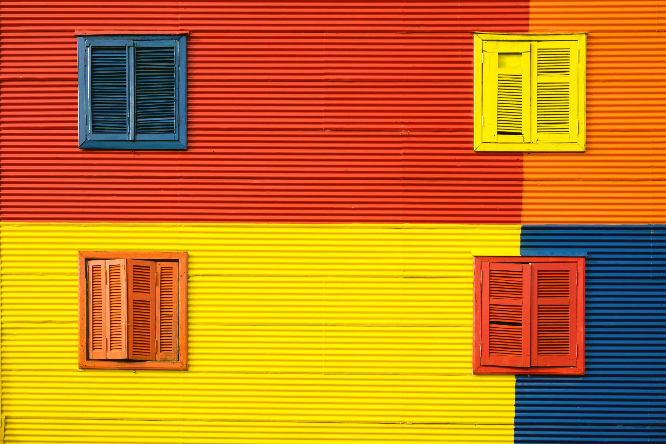 Interior Design Fact- Color Psychology represented by a Colorful House.
