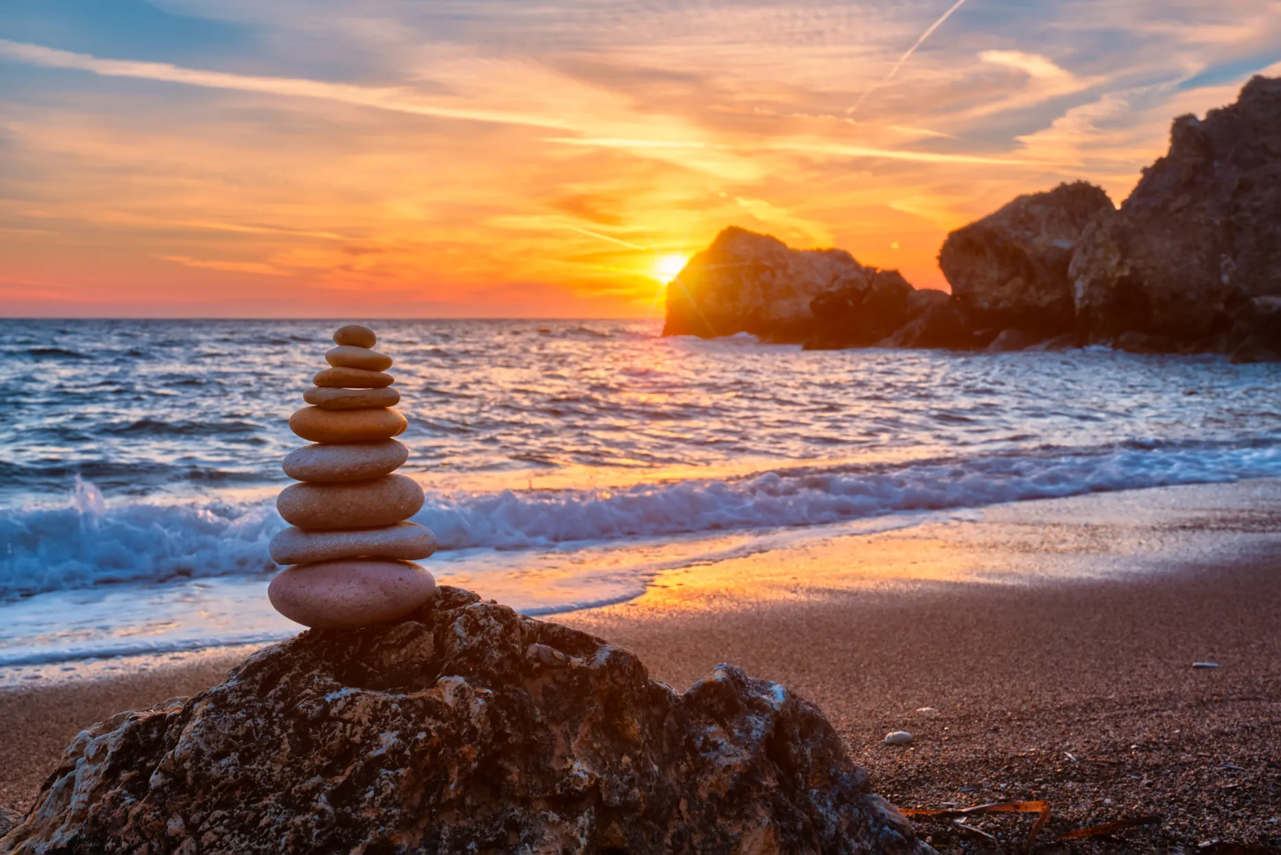 Interior Design Fact- Feng Shui, Concept of balance and harmony - stone stack on the beach.